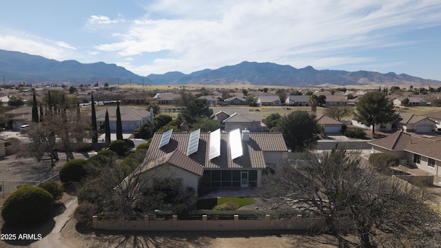 drone / aerial view featuring a residential view and a mountain view