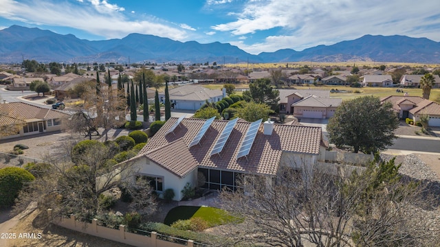 drone / aerial view featuring a residential view and a mountain view