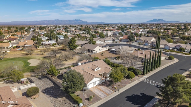 drone / aerial view featuring a residential view and a mountain view