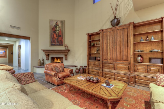 living room with a towering ceiling