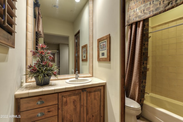 full bathroom with vanity, toilet, and shower / bath combo