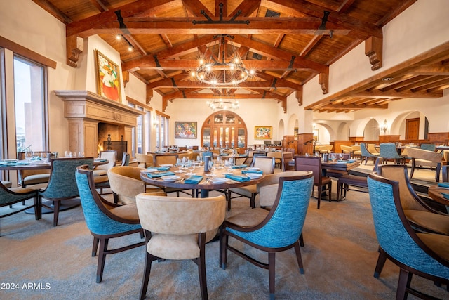 dining area with beamed ceiling, high vaulted ceiling, wooden ceiling, and an inviting chandelier