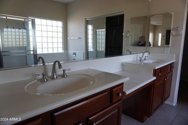 bathroom featuring tile patterned flooring and vanity