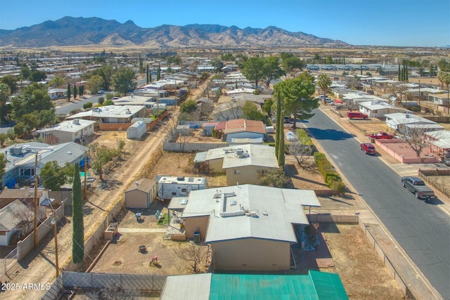 drone / aerial view featuring a residential view and a mountain view