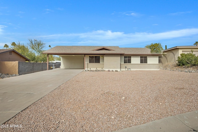 single story home with a carport