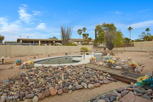 view of yard featuring a fenced in pool and a patio