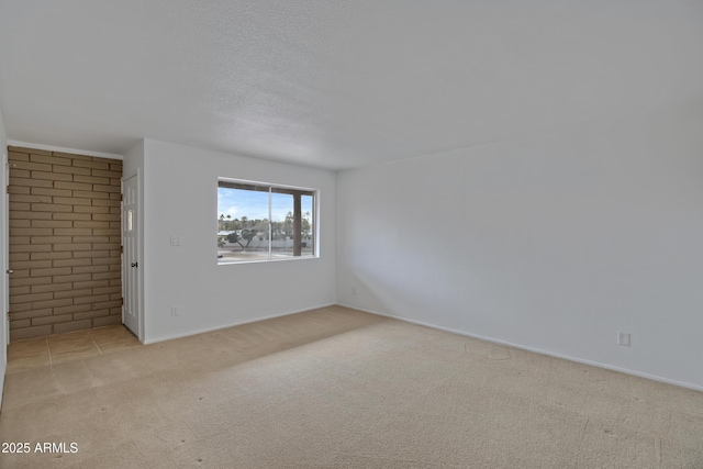 empty room featuring light colored carpet