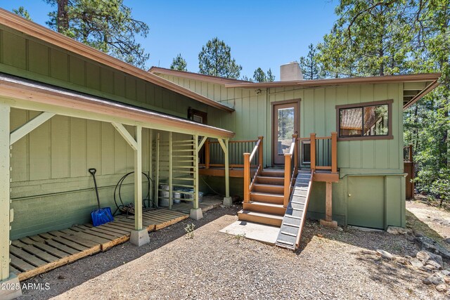 17620 Littlefield Pl, Munds Park, AZ 86017 - property entrance with a chimney and a wooden deck