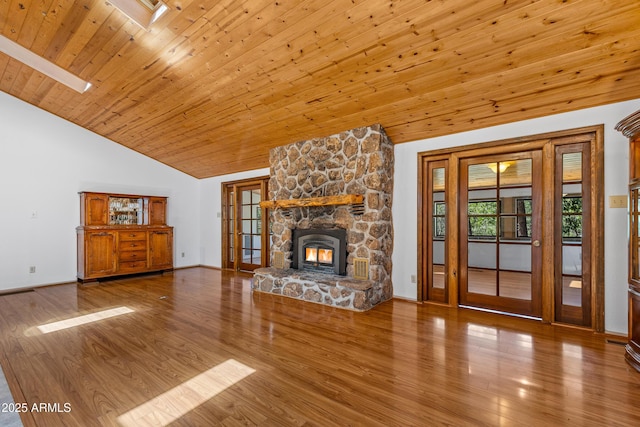 17620 Littlefield Pl, Munds Park, AZ 86017 - unfurnished living room with wood ceiling, wood finished floors, french doors, a fireplace, and high vaulted ceiling