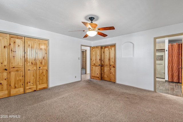 17620 Littlefield Pl, Munds Park, AZ 86017 - unfurnished bedroom with carpet floors, ceiling fan, and connected bathroom