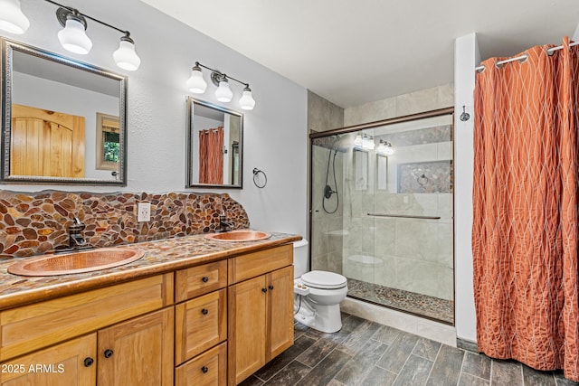 17620 Littlefield Pl, Munds Park, AZ 86017 - full bathroom featuring double vanity, a tile shower, decorative backsplash, and wood finished floors