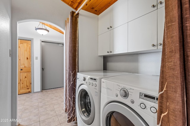 17620 Littlefield Pl, Munds Park, AZ 86017 - laundry room featuring washer and clothes dryer, cabinet space, wooden ceiling, and light tile patterned floors