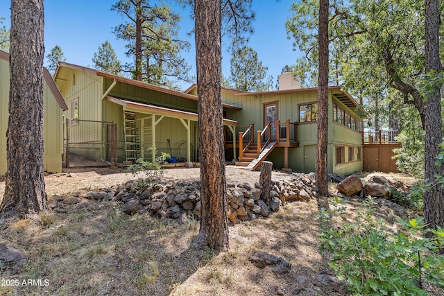 17620 Littlefield Pl, Munds Park, AZ 86017 - rear view of property with a chimney, a gate, stairs, and a wooden deck