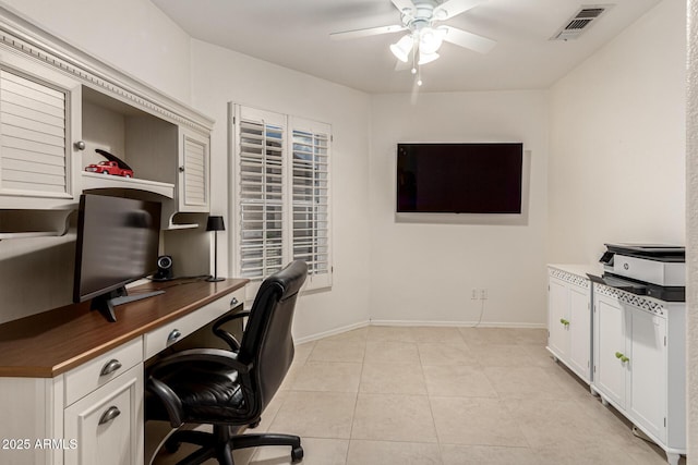 office with light tile patterned floors, visible vents, baseboards, and a ceiling fan