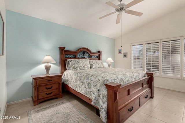 bedroom featuring light tile patterned floors, baseboards, ceiling fan, and vaulted ceiling