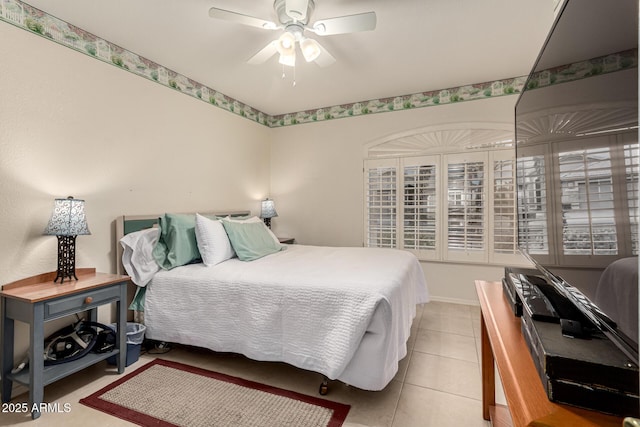 bedroom featuring light tile patterned flooring and a ceiling fan