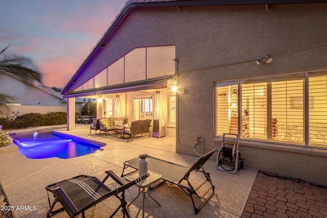 view of swimming pool featuring a fenced in pool, an outdoor hangout area, and a patio