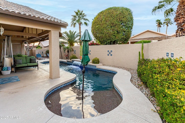 view of swimming pool with an outdoor living space, a fenced in pool, a patio, and a fenced backyard