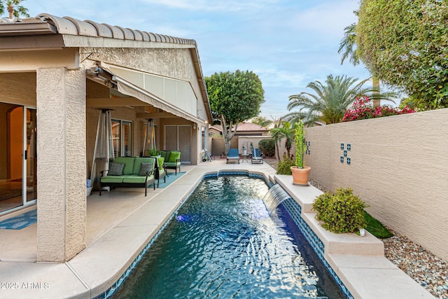 view of pool featuring a patio area, an outdoor living space, a fenced backyard, and a fenced in pool