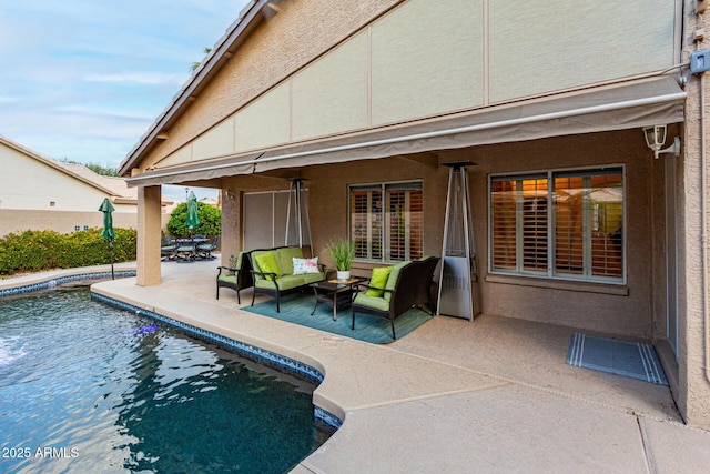 view of pool featuring a patio, a fenced in pool, and an outdoor hangout area