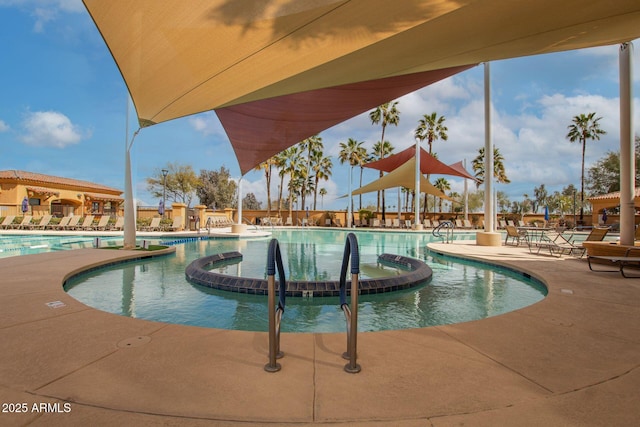 pool with a patio area