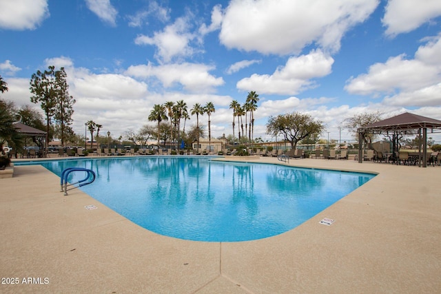 pool featuring a gazebo and a patio area