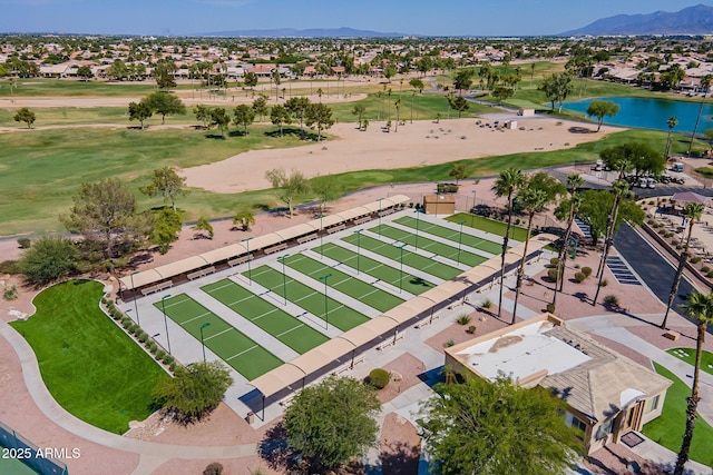 drone / aerial view featuring a residential view, a water and mountain view, and view of golf course