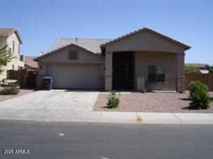 view of front of property featuring a garage and central air condition unit