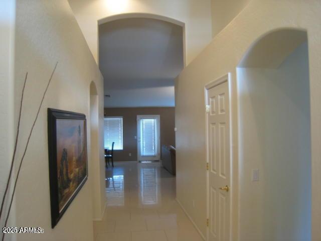 corridor featuring light tile patterned flooring