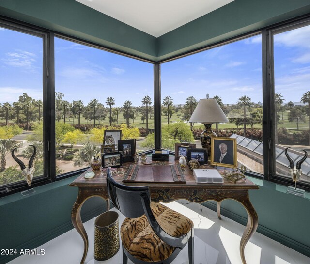 sunroom / solarium featuring a healthy amount of sunlight