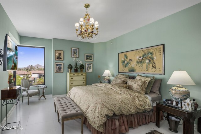 tiled bedroom with a notable chandelier