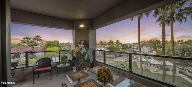 view of balcony at dusk