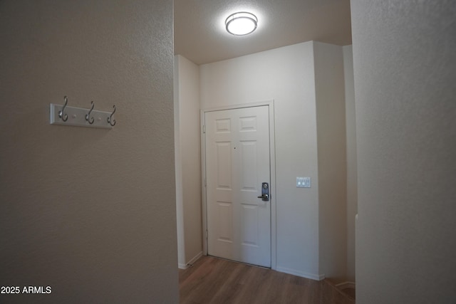 435 W Rio Salado Pkwy Unit 210, Tempe, AZ 85281 - doorway featuring baseboards, wood finished floors, and a textured wall