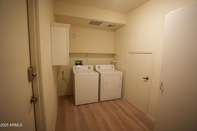 435 W Rio Salado Pkwy Unit 210, Tempe, AZ 85281 - washroom featuring washing machine and clothes dryer, visible vents, laundry area, and light wood-type flooring