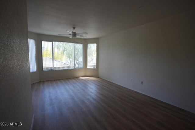 435 W Rio Salado Pkwy Unit 210, Tempe, AZ 85281 - unfurnished room with baseboards, ceiling fan, and dark wood-style flooring