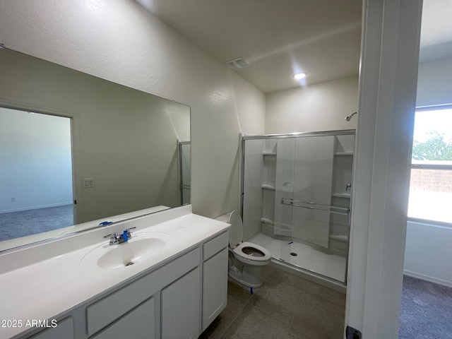 bathroom with tile patterned flooring, vanity, an enclosed shower, and toilet