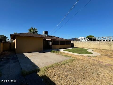 rear view of property featuring a patio