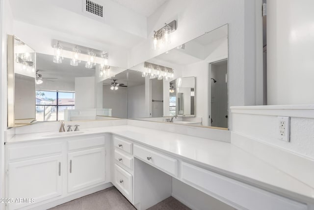 bathroom featuring ceiling fan and vanity