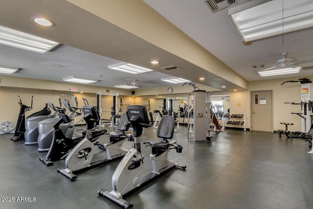 gym featuring a textured ceiling