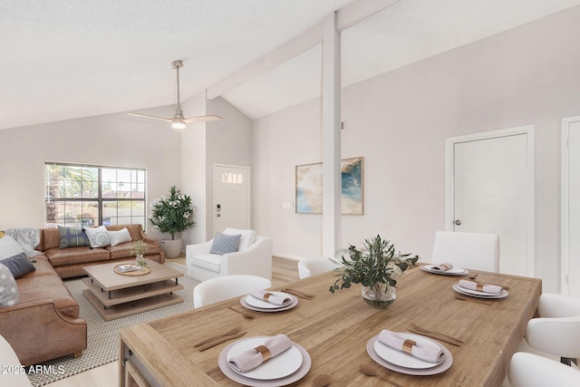 living room with high vaulted ceiling, light hardwood / wood-style floors, and ceiling fan