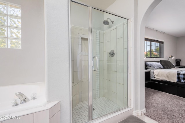 bathroom featuring an enclosed shower