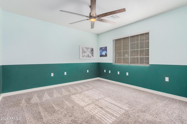 unfurnished room featuring carpet flooring and ceiling fan