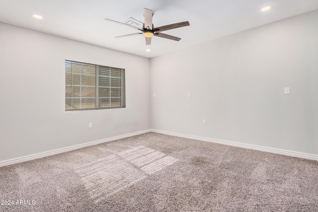 spare room with carpet flooring and ceiling fan