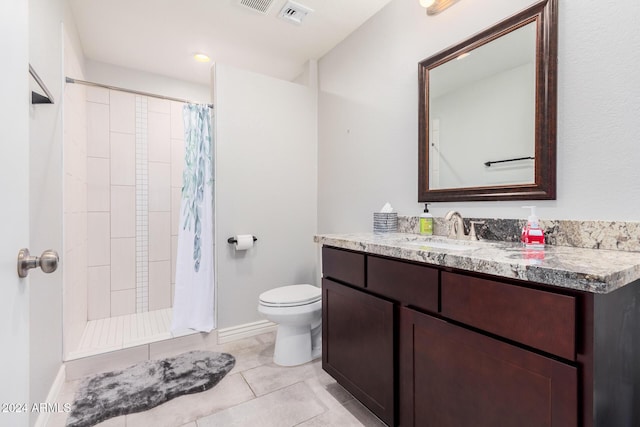 bathroom with tile patterned floors, vanity, toilet, and a shower with curtain