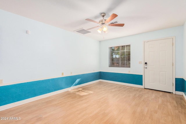 unfurnished room with ceiling fan and light hardwood / wood-style flooring