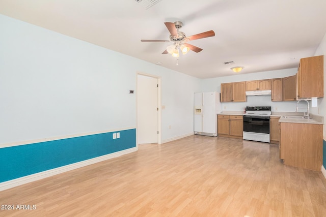 kitchen featuring white appliances, light hardwood / wood-style flooring, ceiling fan, and sink