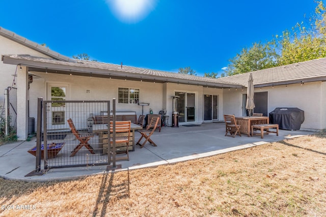 rear view of property with a patio