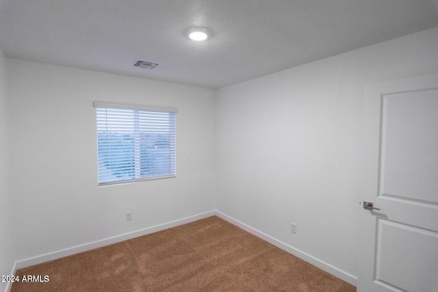 spare room with carpet floors