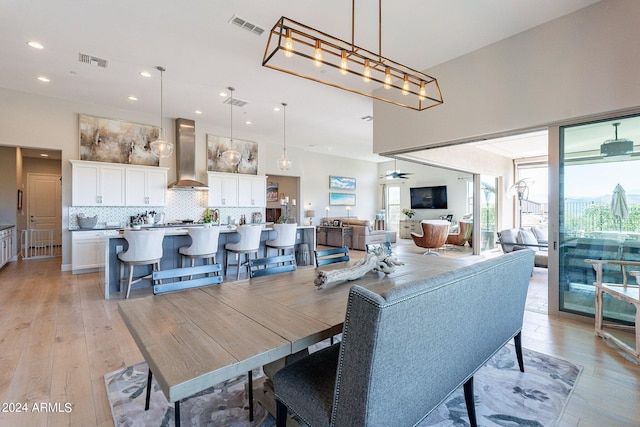 dining space featuring light wood-type flooring