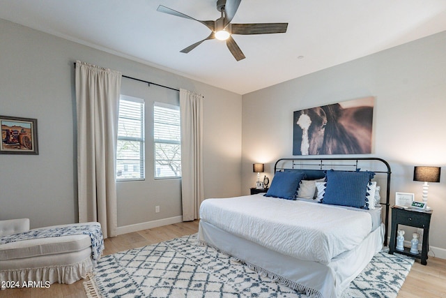 bedroom featuring ceiling fan and light hardwood / wood-style floors